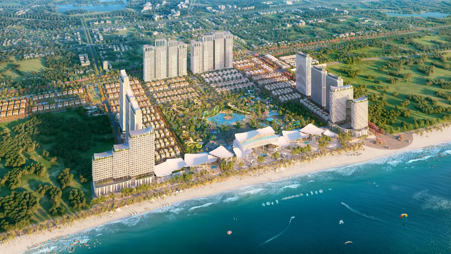 Phối cảnh tổng thể Blanca City nhìn từ biển Bãi Sau: dải khách sạn và trung tâm thương mại sát bãi cát, công viên nước ở lõi, các tháp căn hộ và khu thấp tầng mái ngói đỏ phía trong
